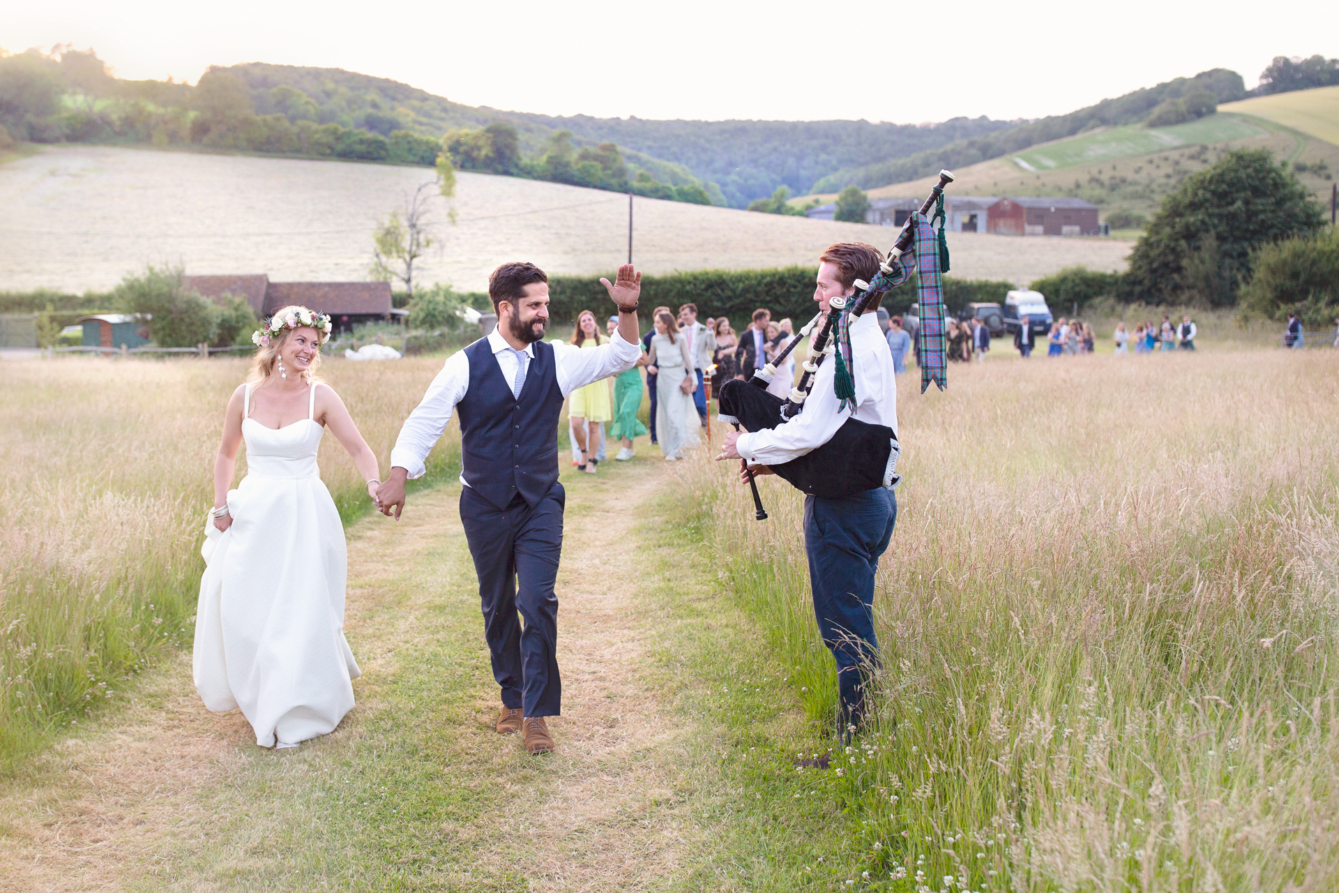 Bagpipe led bridal procession at Upwaltham Barns in Chichester