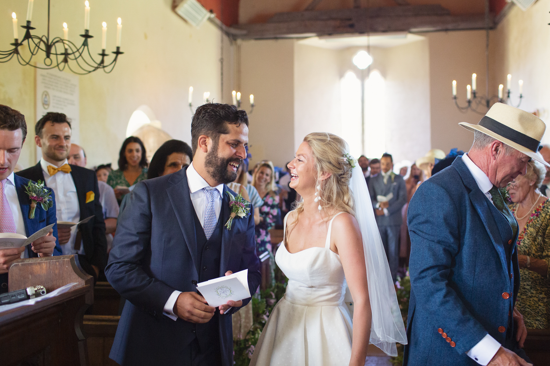 Bride marries groom at Upwaltham Barns in the church