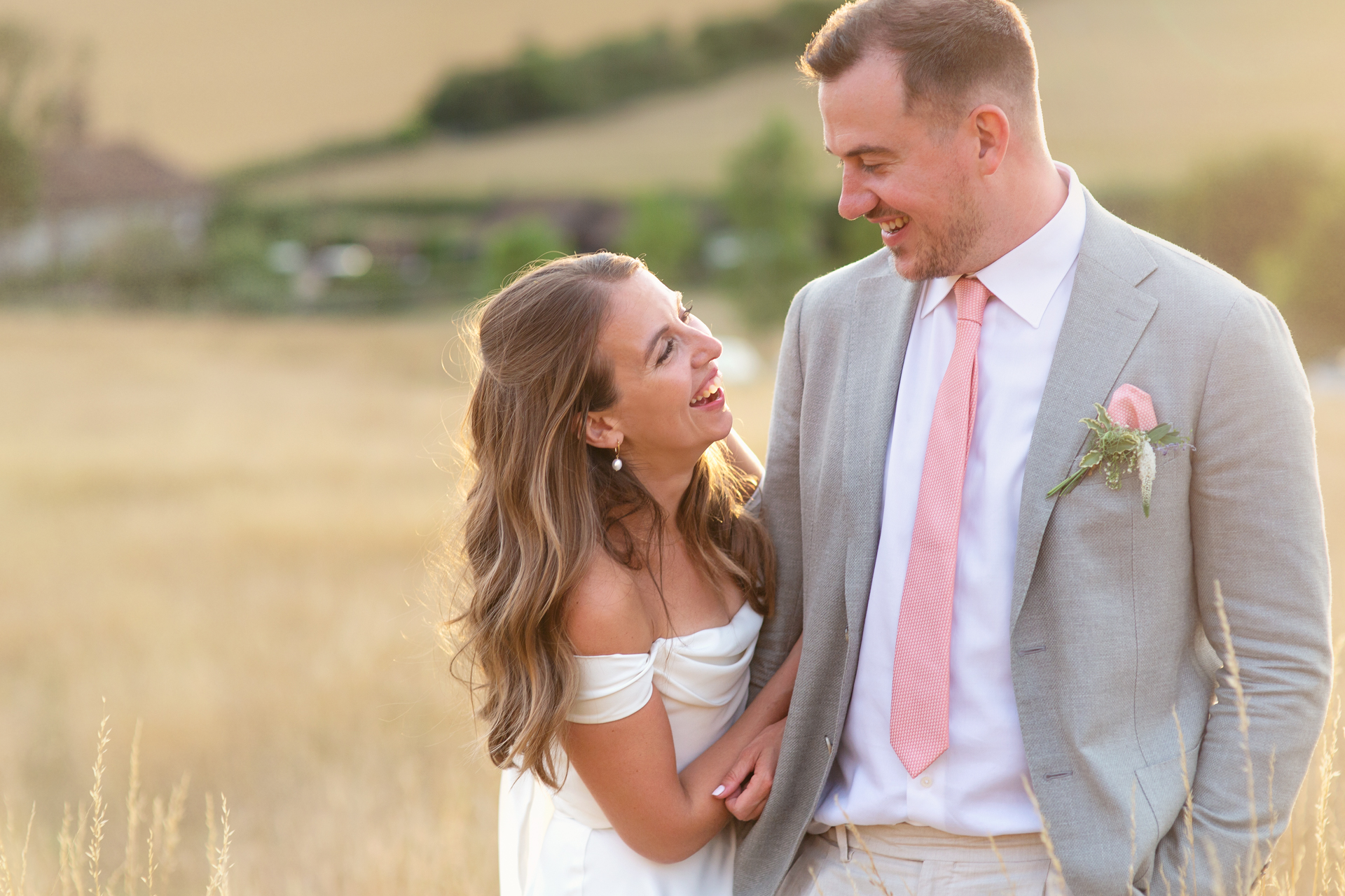 Relaxed wedding couple shots at golden hour at Upwaltham Barns